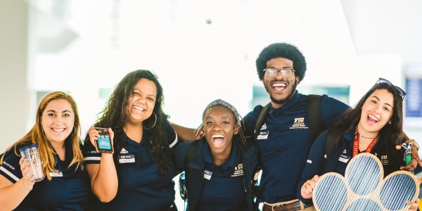 Group of FIU students posing for a picture smiling at the camera. 