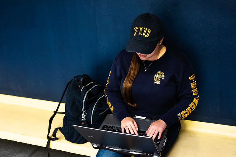 FIU Online Student with laptop