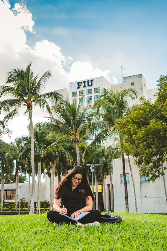 Student studies outside Green Library