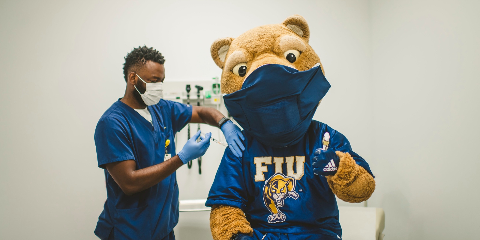 FIU mascot, Roary, getting his vaccination for Covid 19